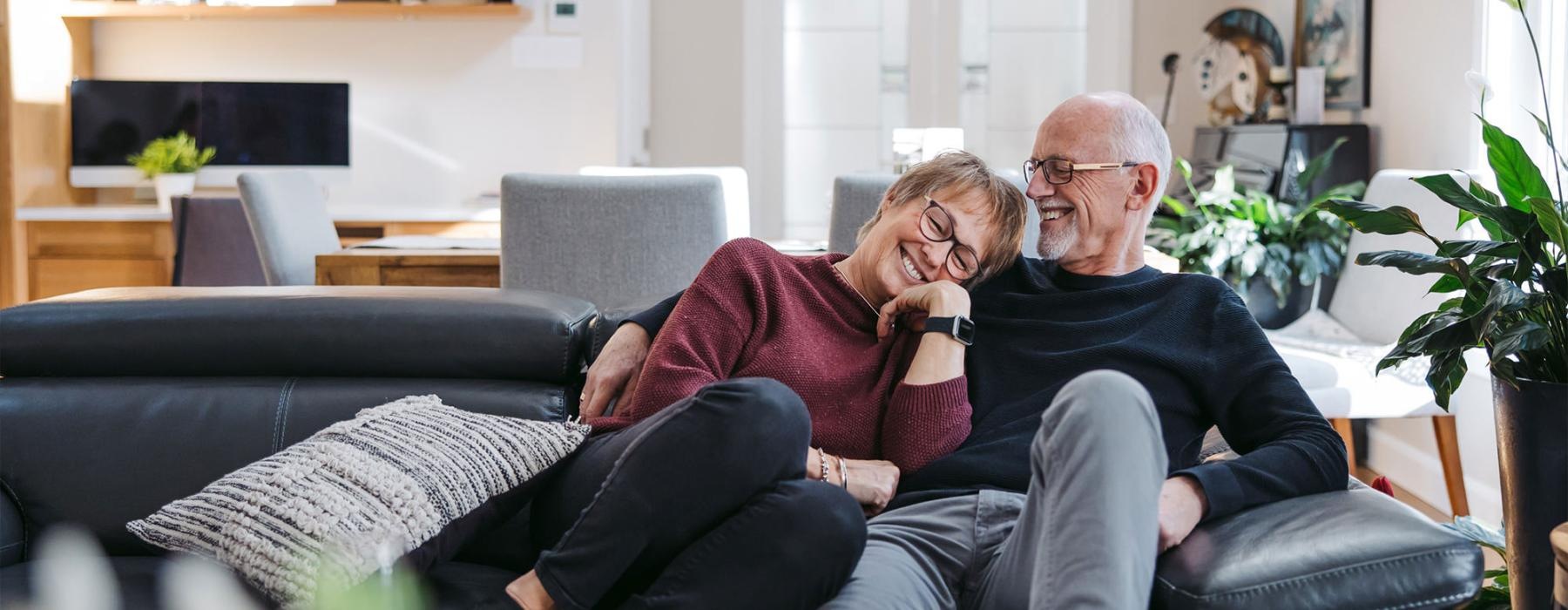 a man and woman sitting on a couch